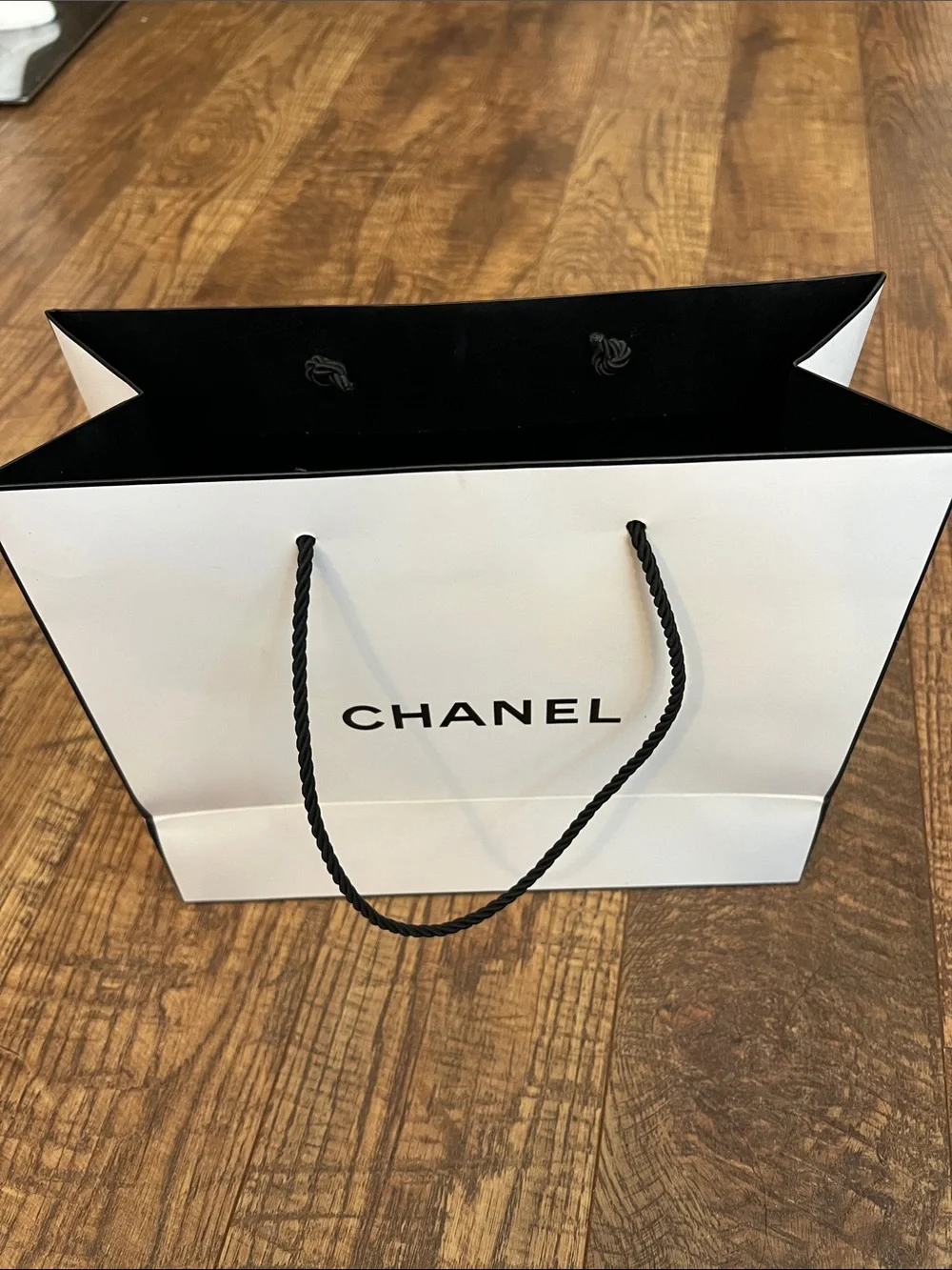 CHANEL White Gift Bag with Black Rope Handles and Camellia Sticker
